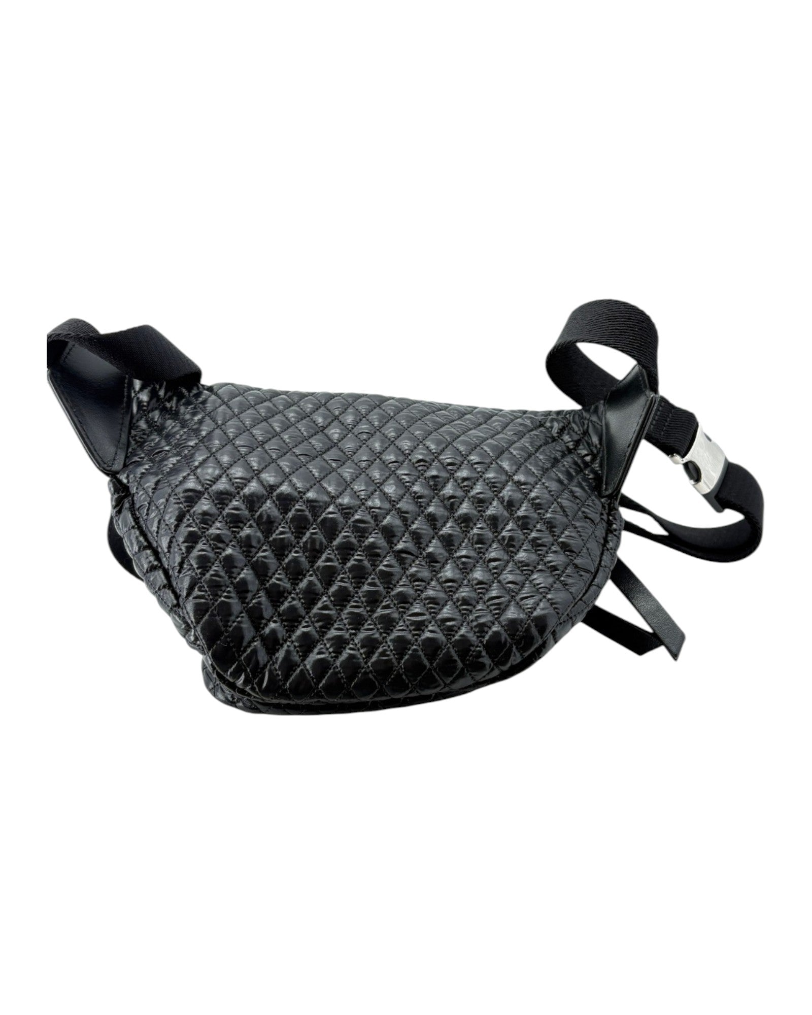 Black quilted leather bag with straps on a white background