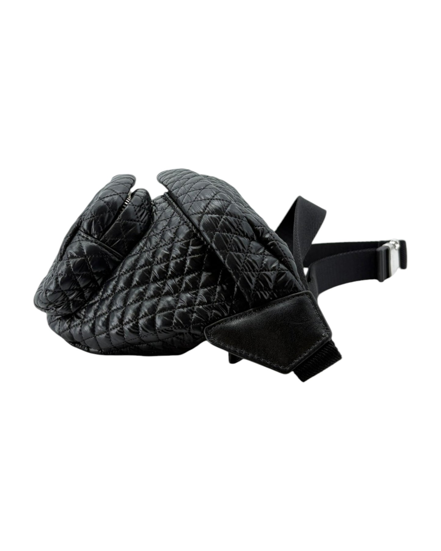 Black quilted leather glove with a strap on a white background