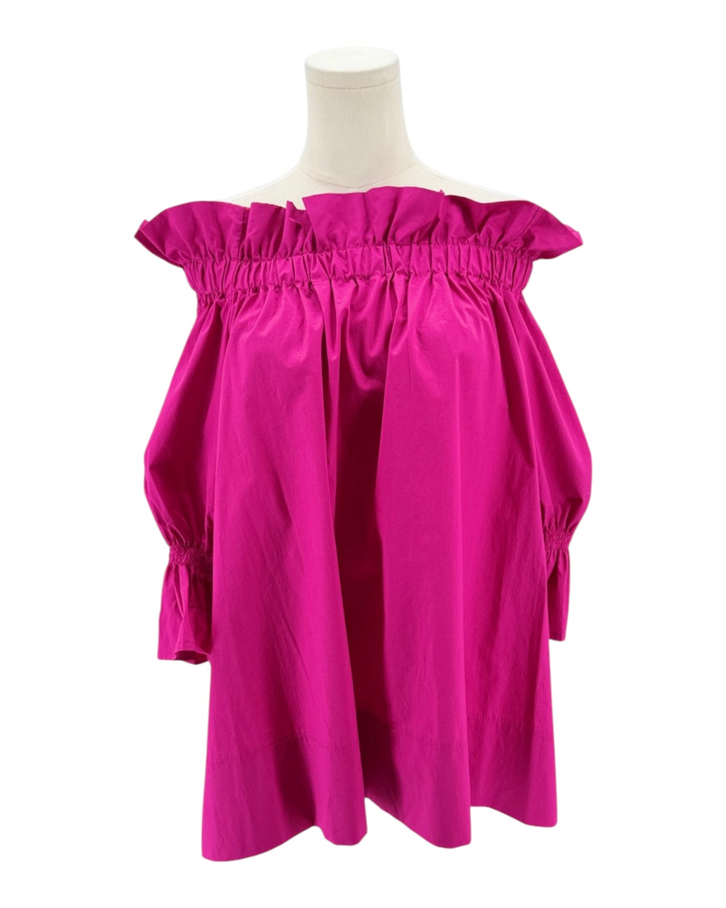 Pink off-shoulder dress on a mannequin against a white background