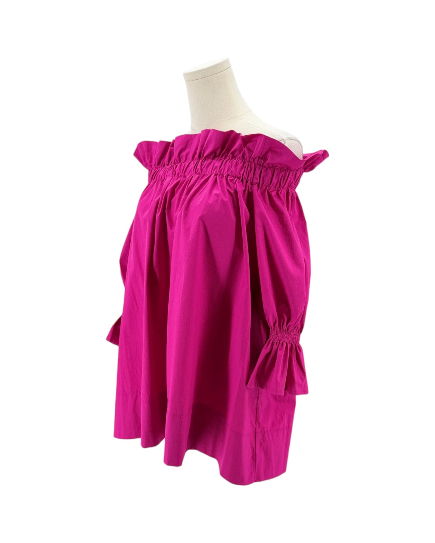 Pink dress on a mannequin against a white background