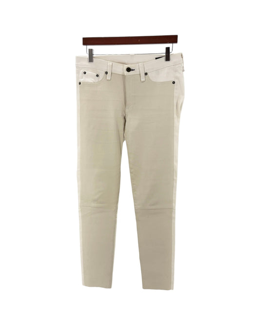 Beige pants on a hanger against a white background
