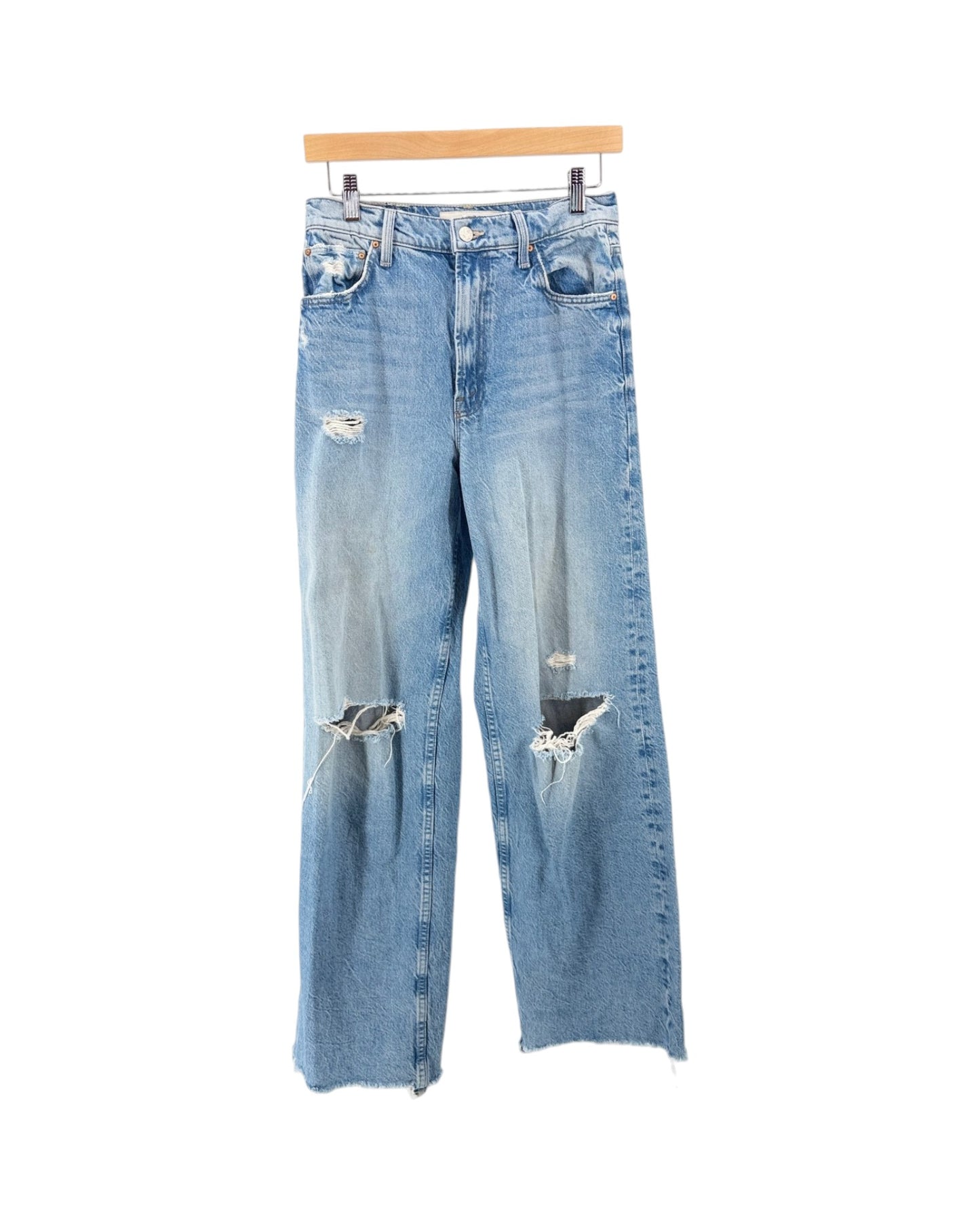 Light wash blue distressed jeans with ripped details on the thighs and knees, hanging from a wooden hanger against a plain white background.