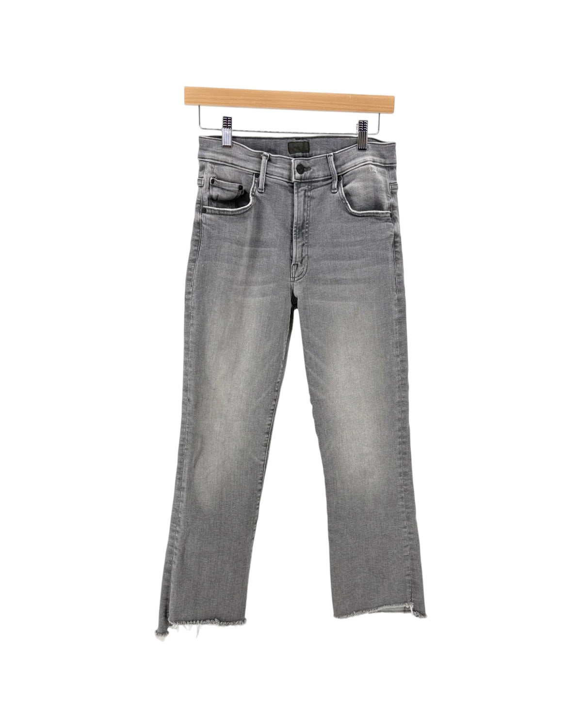 Gray denim jeans on a hanger on a white background