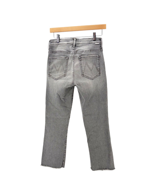 Gray denim jeans on a hanger on a white background