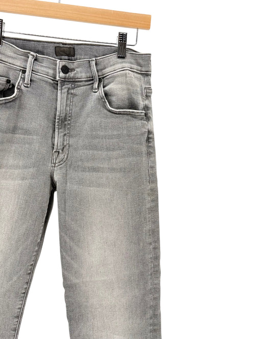 Gray denim jeans on a hanger on a white background