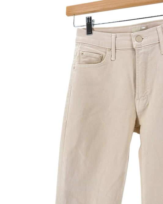 Light beige cream denim jeans on a hanger on a white background