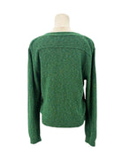 Green cardigan sweater on a mannequin against a white background