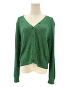 Green cardigan sweater on a mannequin against a white background