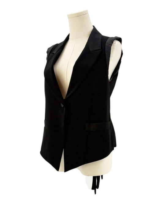 Nanette Lepore black sleeveless blazer with a tie waist on a mannequin against a white background