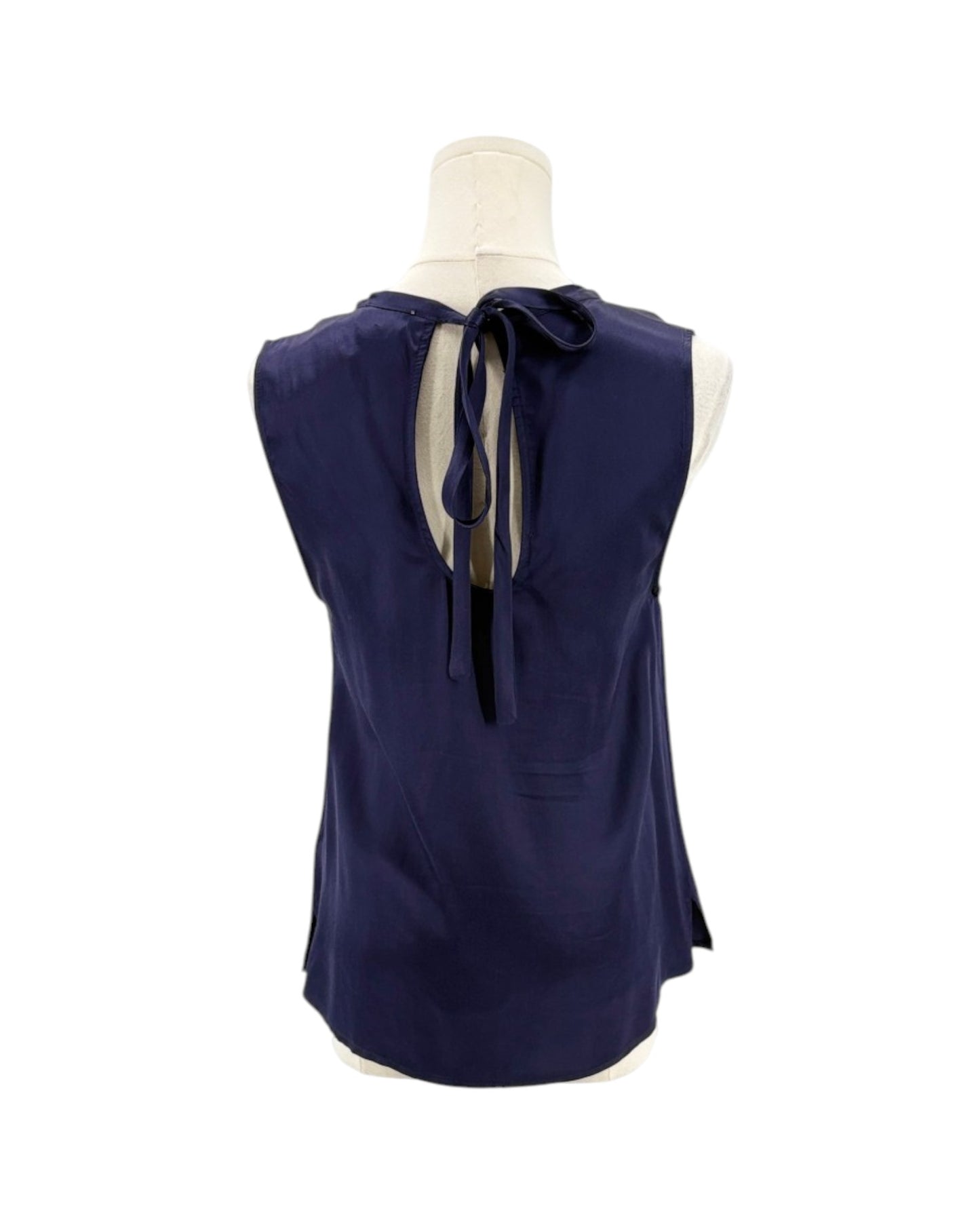 Navy blue sleeveless top with a bow detail on a white background