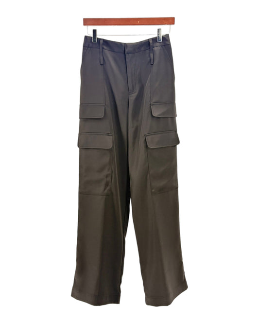 Black cargo pants on a hanger against a white background
