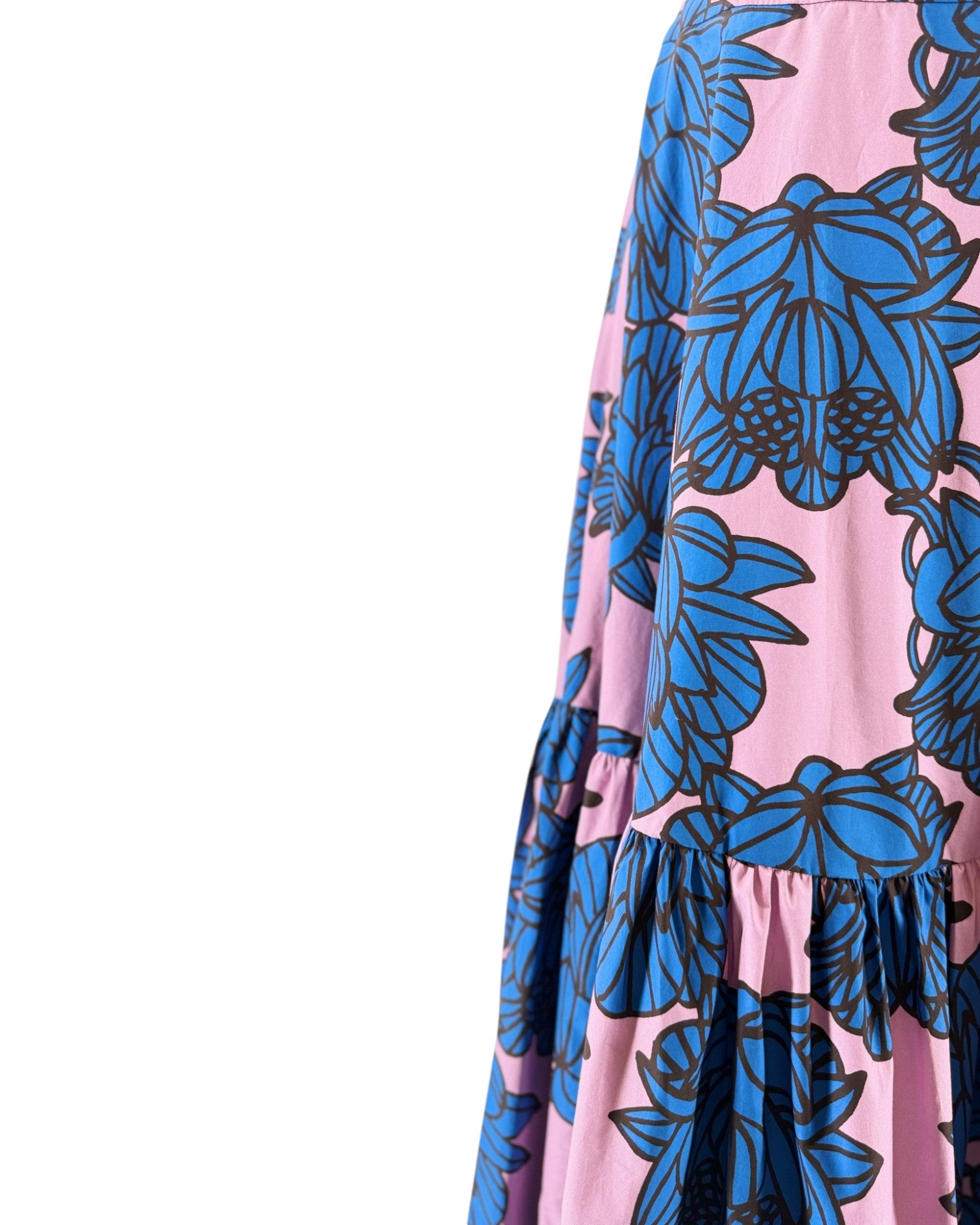 Pink dress with blue floral pattern on a white background