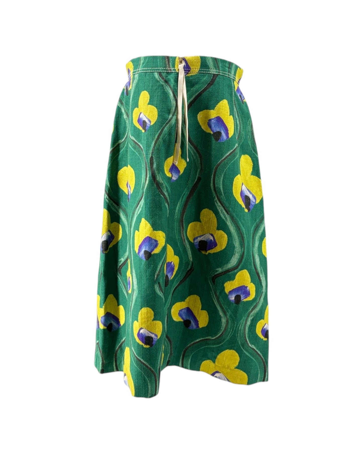 Green skirt with yellow and purple floral pattern on a white background