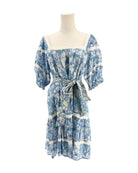 Blue floral dress on a mannequin against a white background