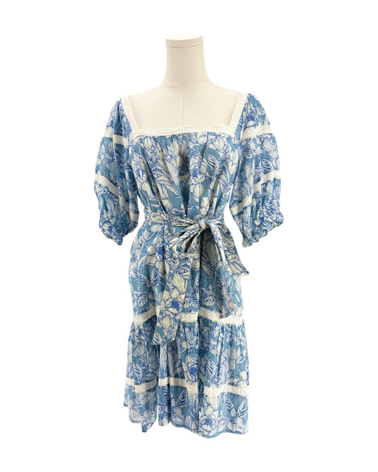 Blue floral dress on a mannequin against a white background