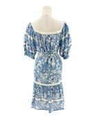 Blue floral dress on a mannequin against a white background
