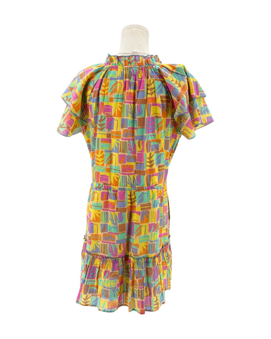 Multicolored mini dress on a mannequin on a white background