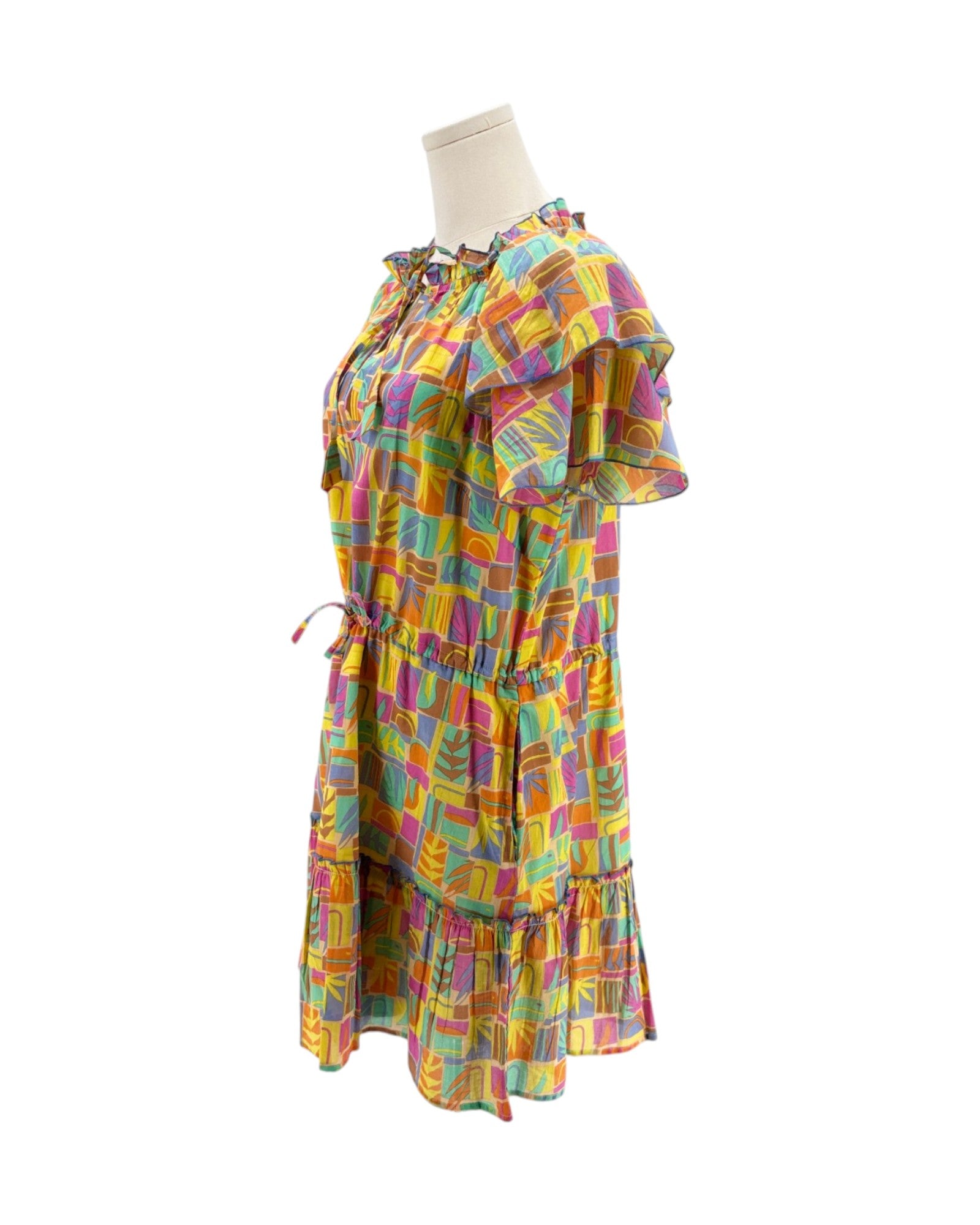 Multicolored mini dress on a mannequin on a white background