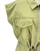 Green sleeveless mini dress on a mannequin against a white background