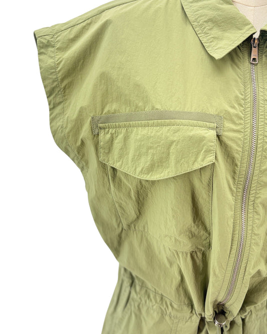 Green sleeveless mini dress on a mannequin against a white background