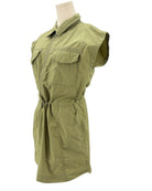 Green sleeveless mini dress on a mannequin against a white background