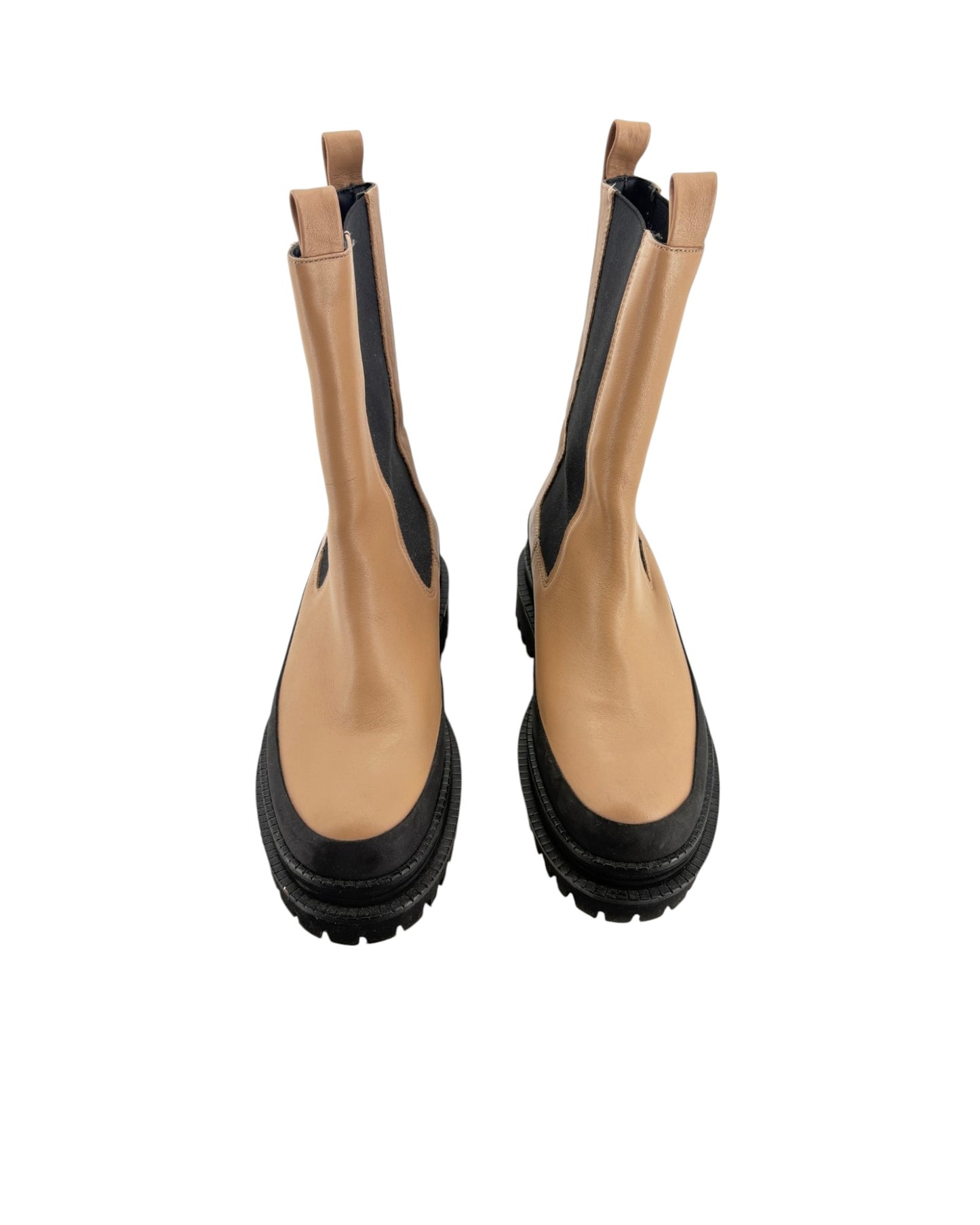 Tan and black platform boots on a white background