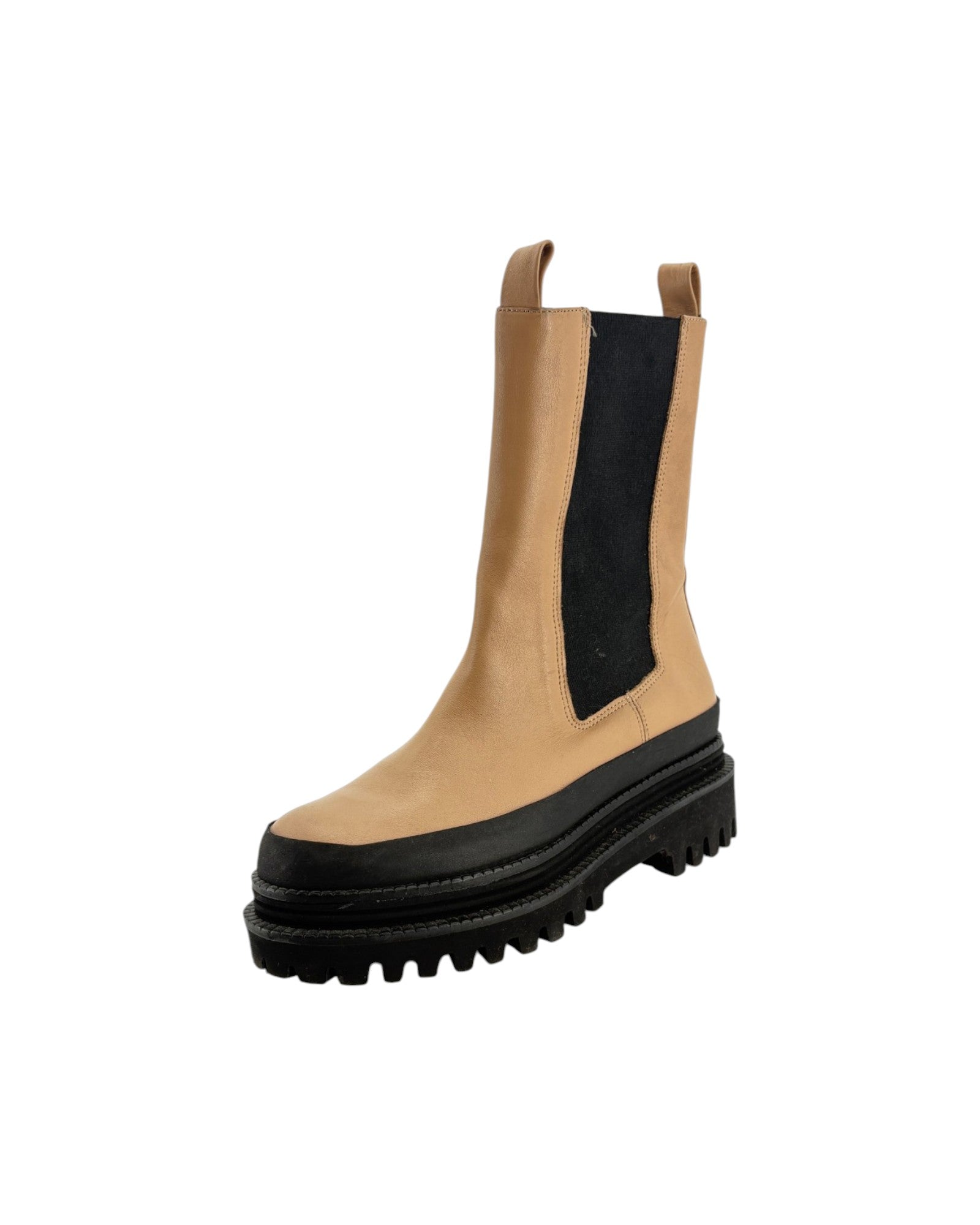 Tan Chelsea boot with black sole on a white background