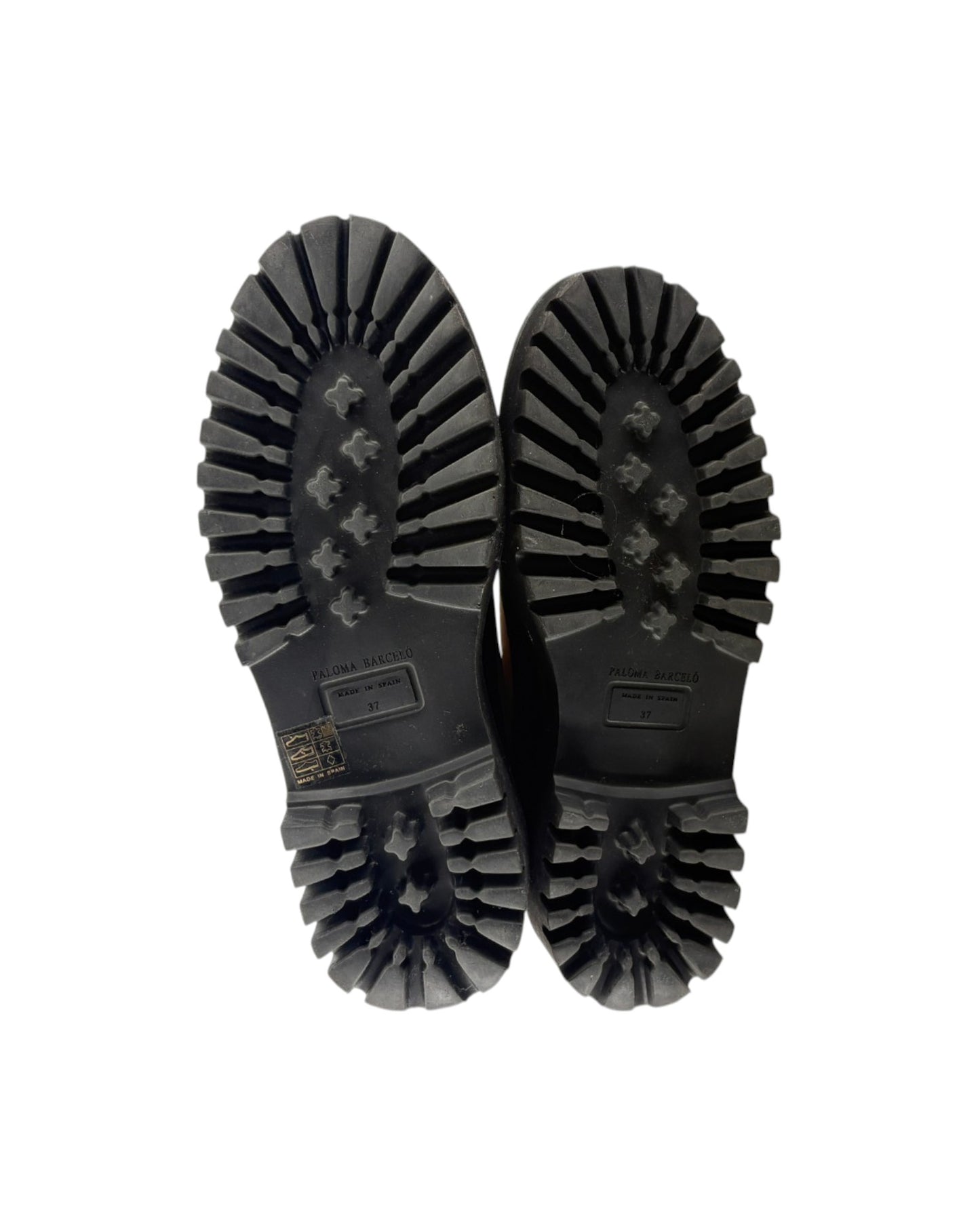 Black shoes with textured sole on a white background