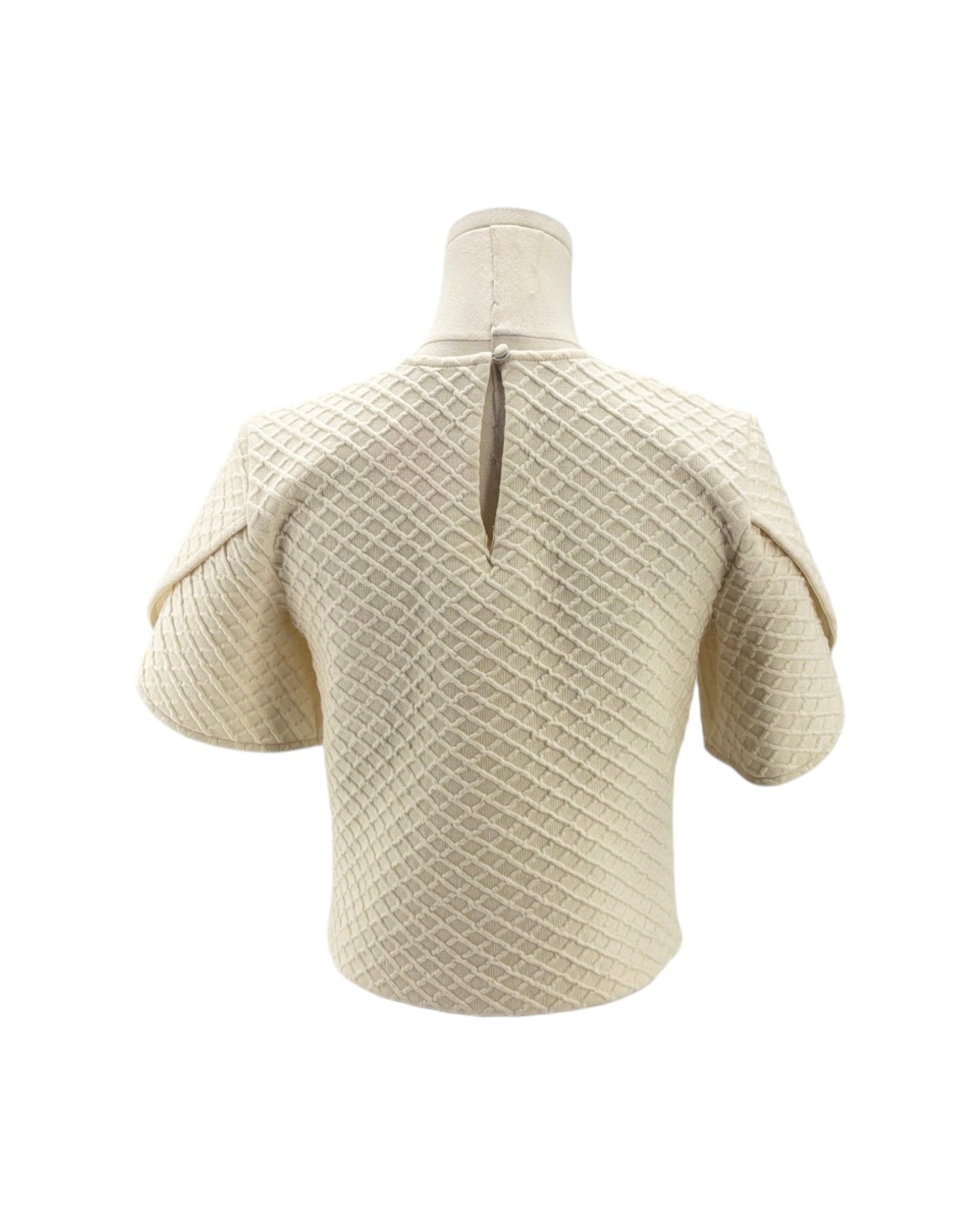 Beige knitted short-sleeve sweater on a mannequin against a white background