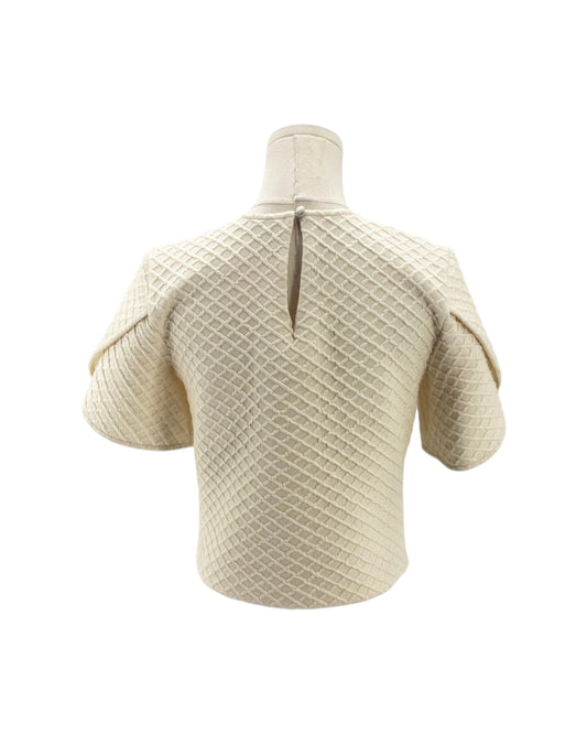 Beige knitted short-sleeve sweater on a mannequin against a white background