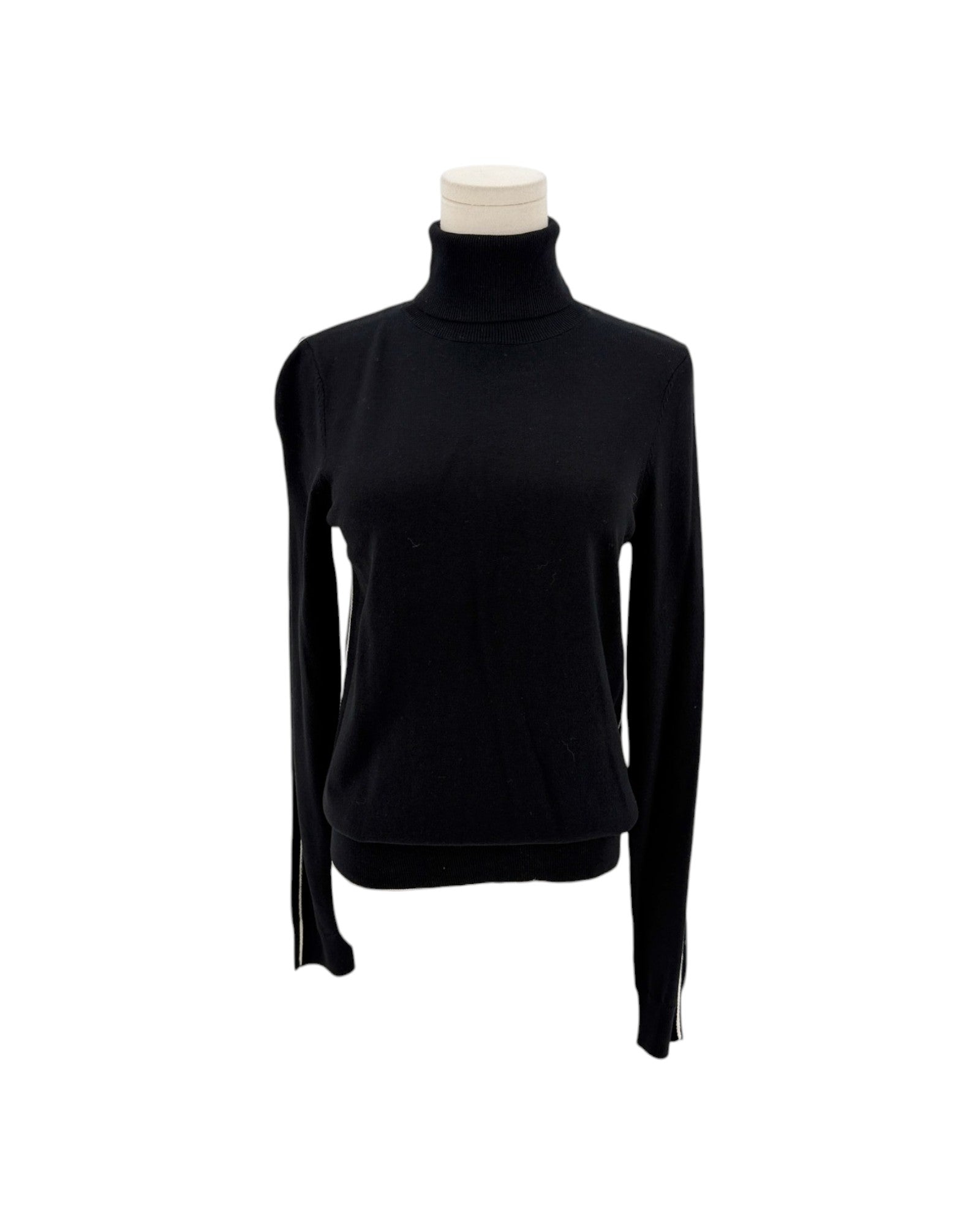 Long sleeve black with a white embroidered strip along the shoulder and sleeve turtleneck sweater on a white background