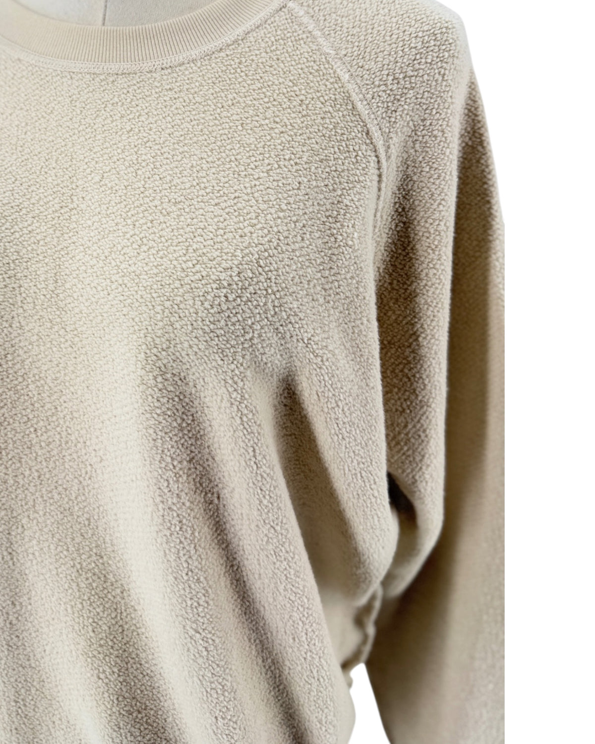 Beige Textured "inside out" cotton fabric, classic crew neckline, raglan style sleeves sweatshirt on a white background on a mannequin