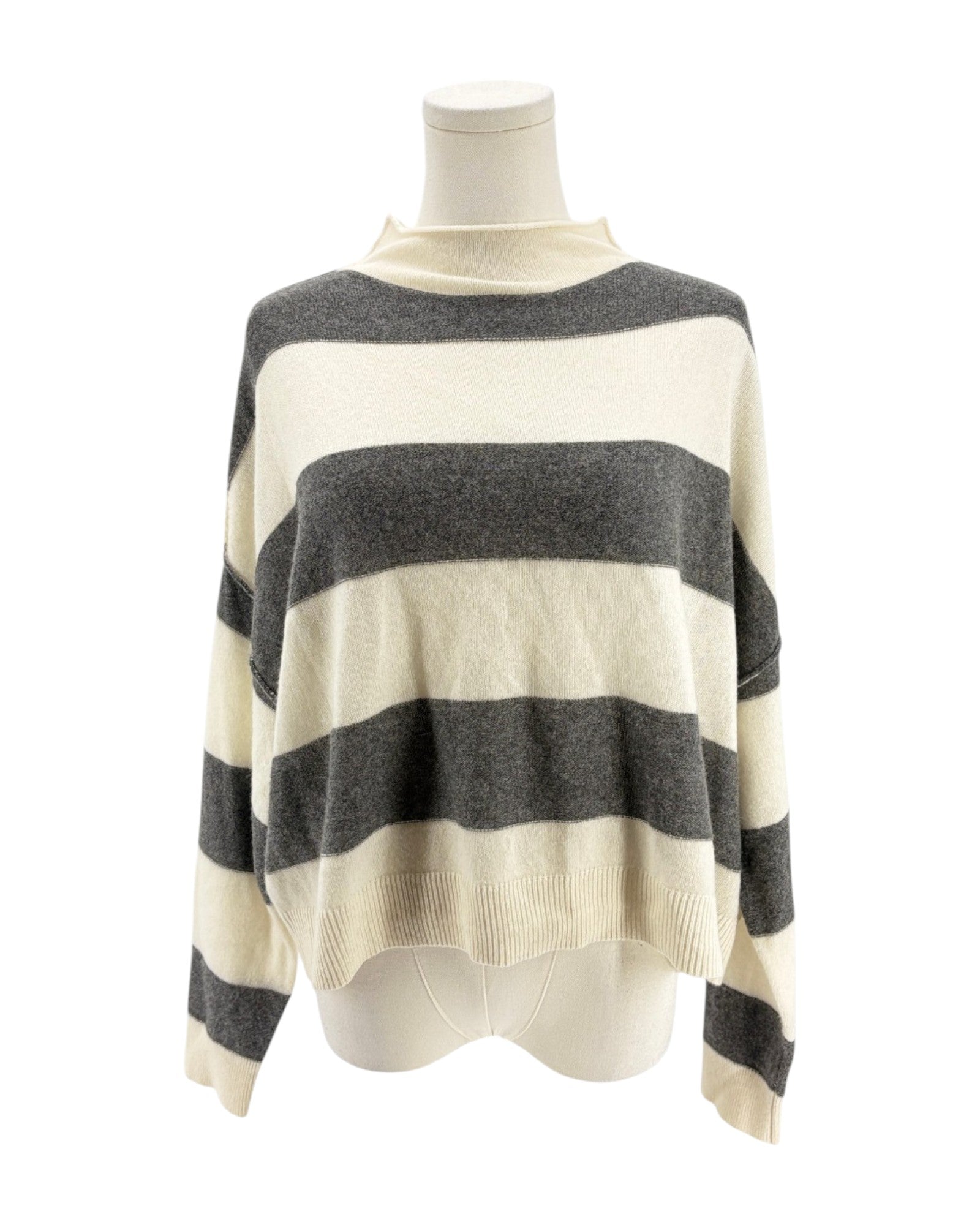 Striped sweater on a mannequin against a white background