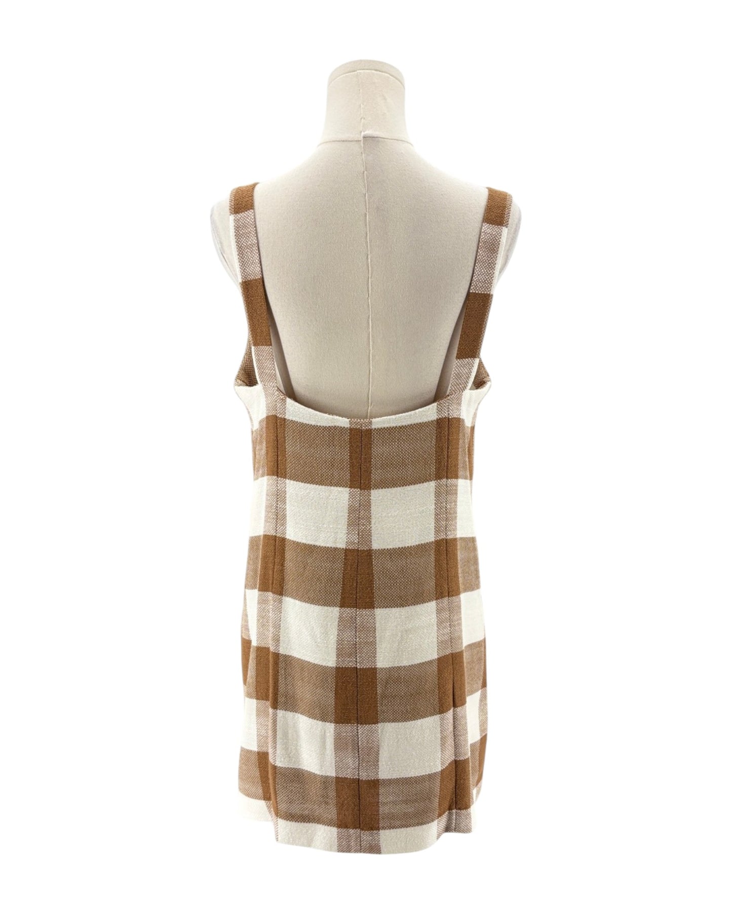 Brown and white checkered dress on a mannequin against a white background