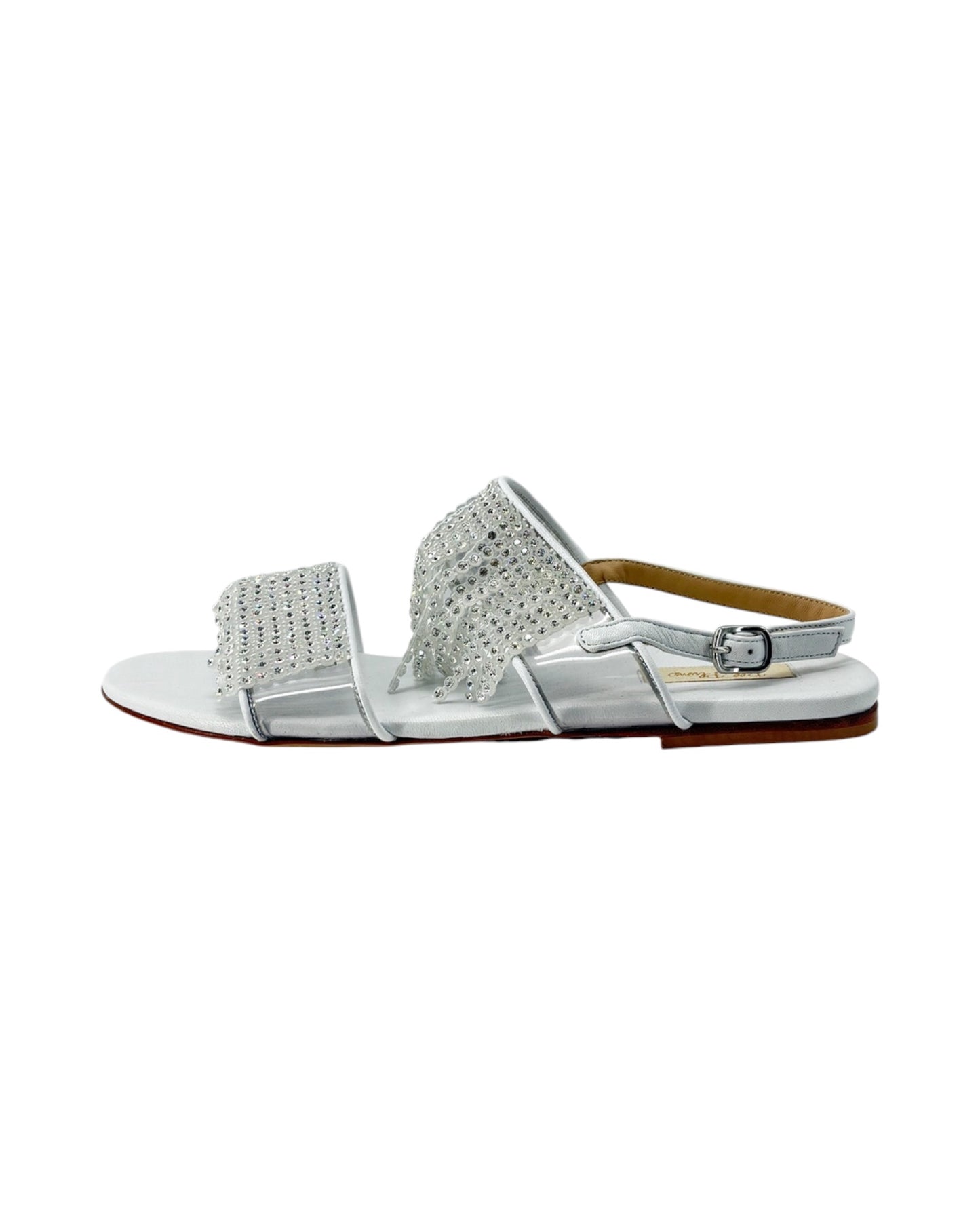 Silver sandal with embellishments on a white background