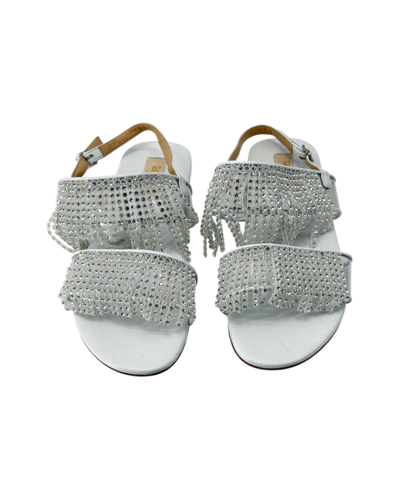 Silver embellished sandals on a white background