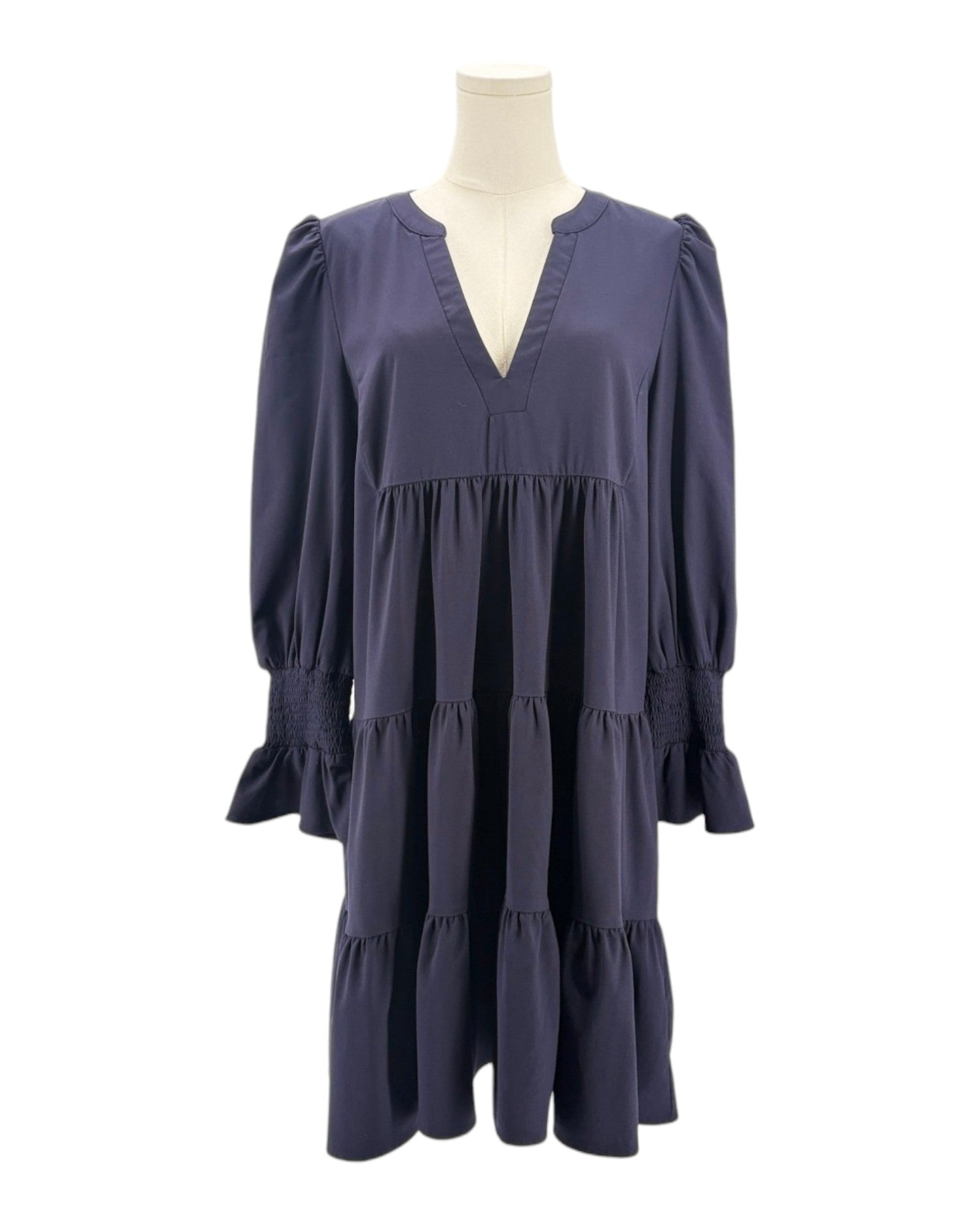 Navy blue dress on a mannequin against a white background