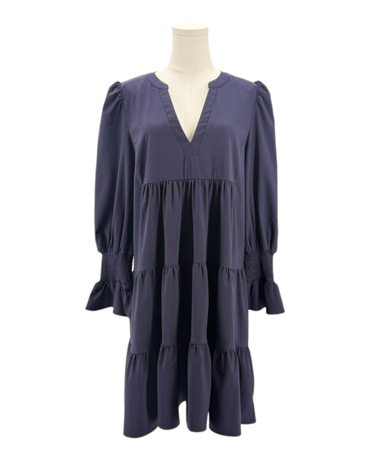 Navy blue dress on a mannequin against a white background