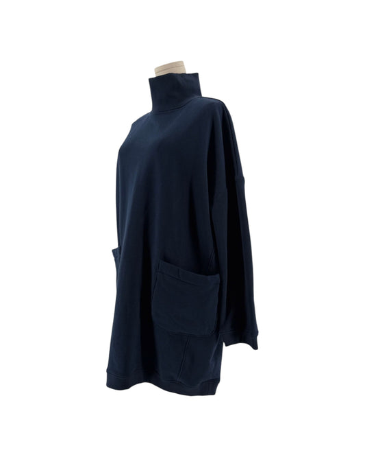 Navy oversized silhouette, high mock/turtleneck, long sleeves, two distinctive large patch pockets on the front on a mannequin on a white background