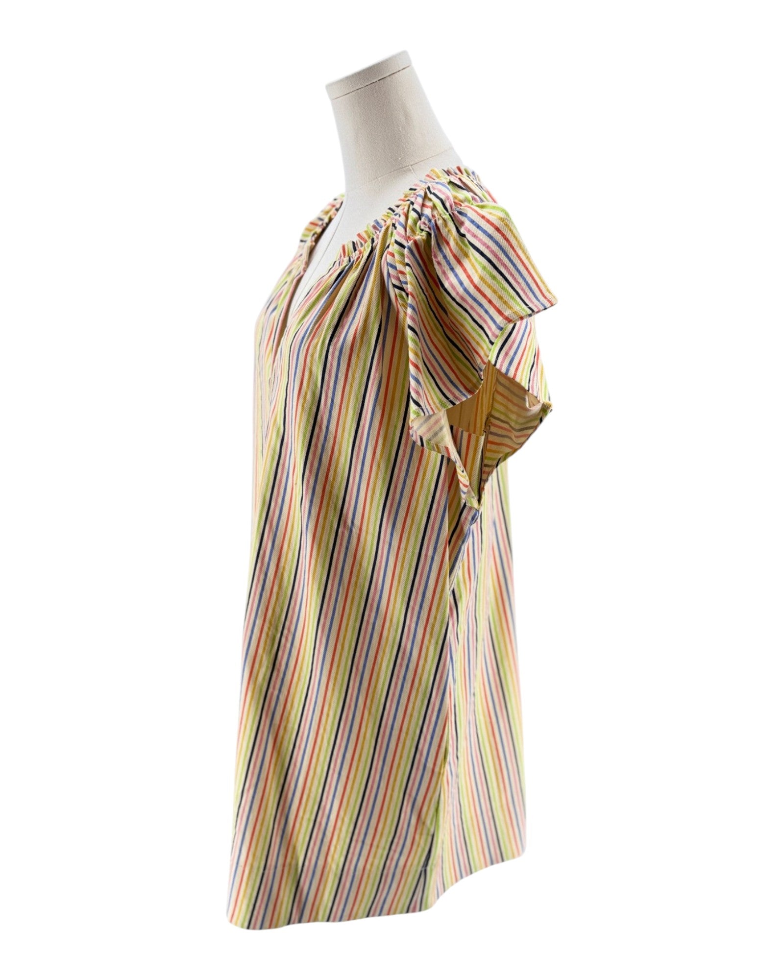 Multicolored striped dress on a mannequin against a white background