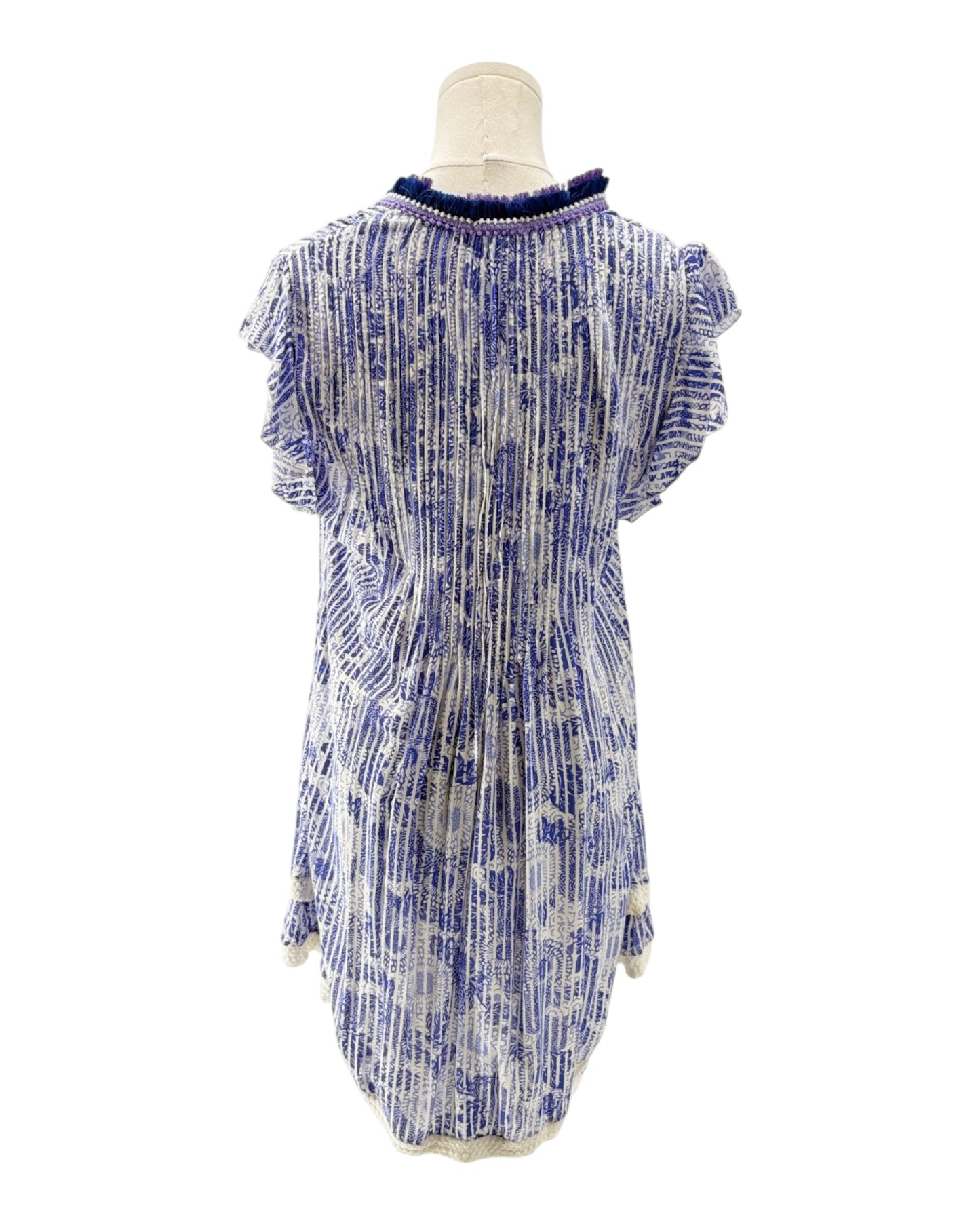 Blue and white patterned dress on a mannequin against a white background