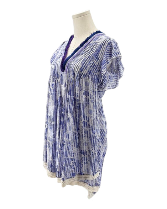 Blue and white patterned top on a mannequin against a white background