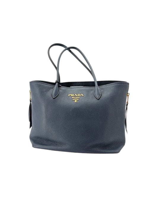 Navy Prada handbag on a white background