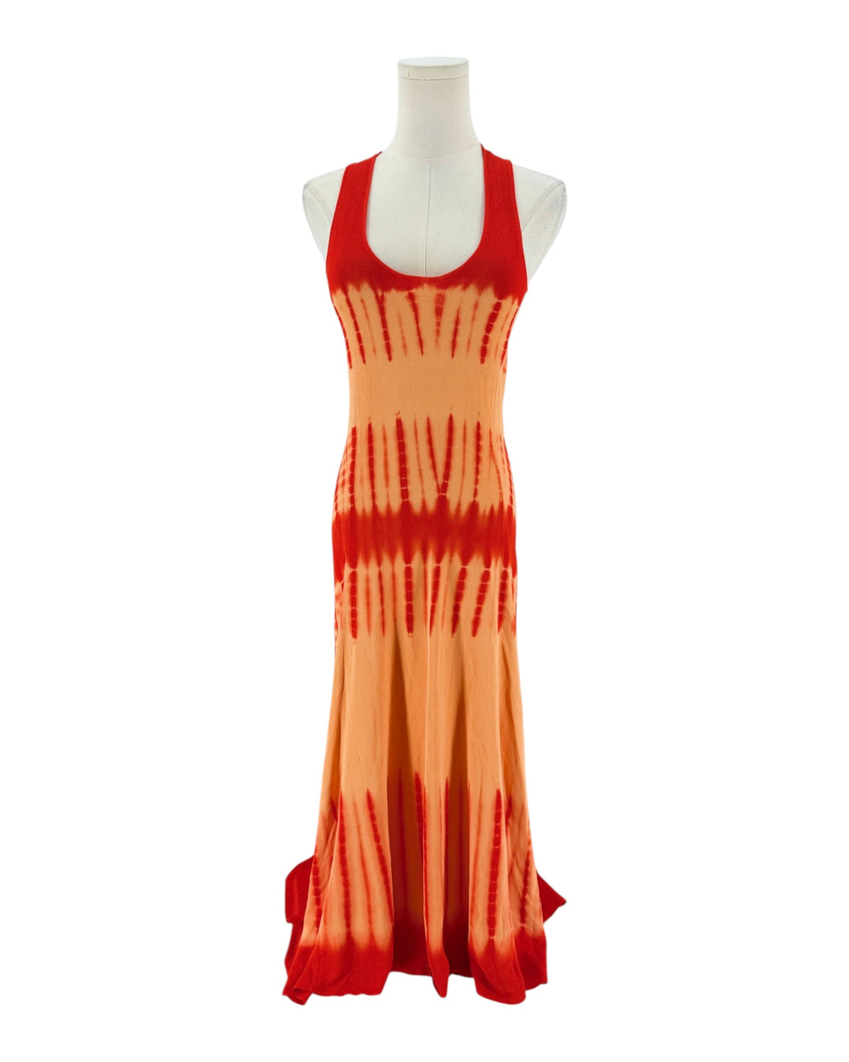 A sleeveless red and orange maxi dress with a tie-dye pattern fading into orange on a white mannequin torso against a white background.
