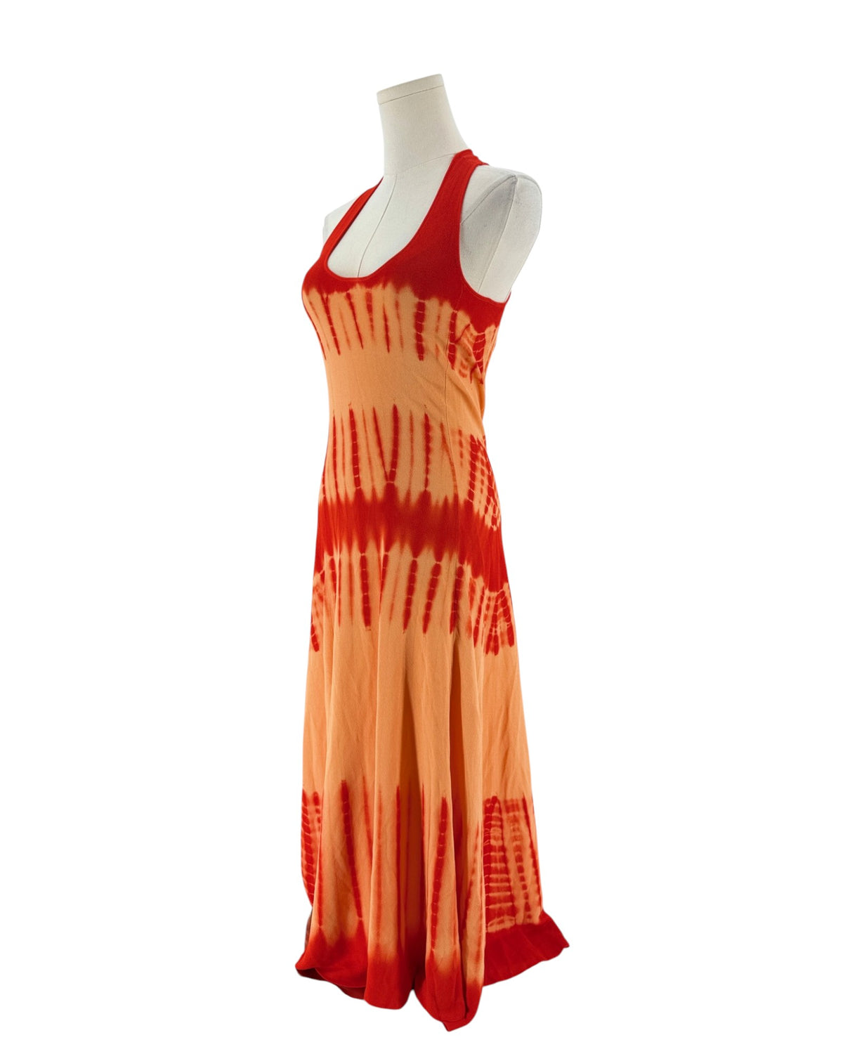 A sleeveless red and orange maxi dress with a tie-dye pattern fading into orange on a white mannequin torso against a white background.
