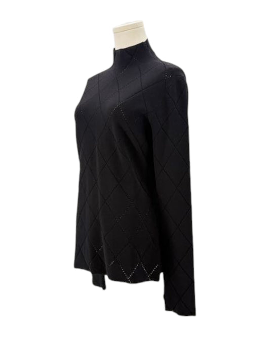 Black diamond-patterned sweater on a mannequin against a white background