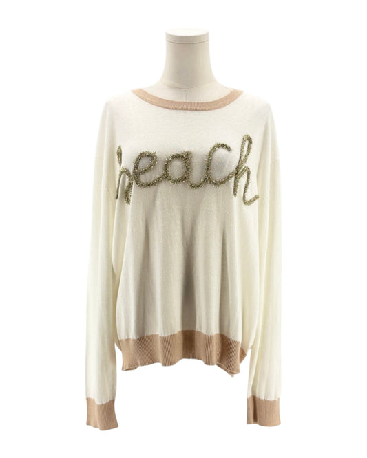 Beige sweater with 'beach' text on a mannequin against a white background
