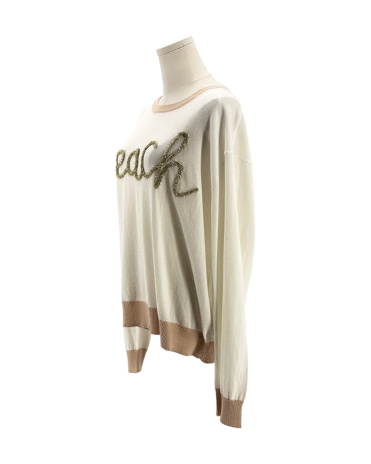 White sweater with brown accents on a mannequin against a white background