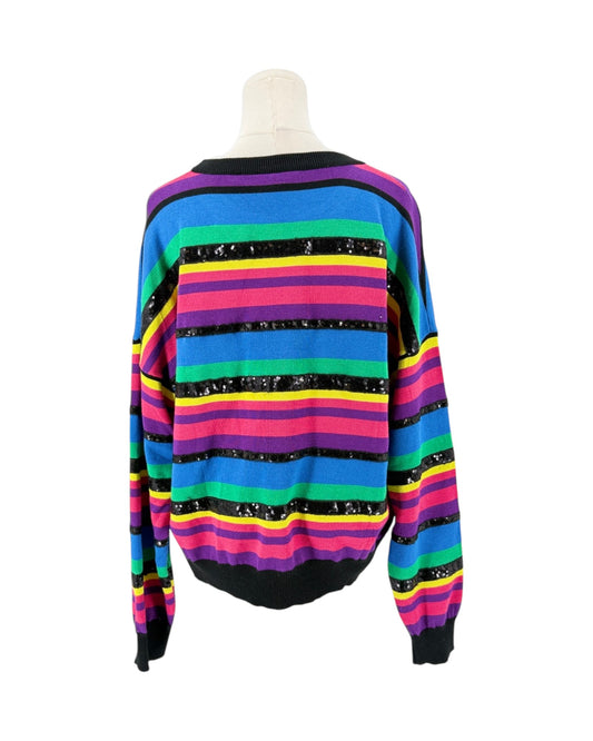 A long-sleeve knit sweater with horizontal rainbow stripes in blue, green, yellow, pink, purple, and black, displayed on a mannequin torso against a white background.