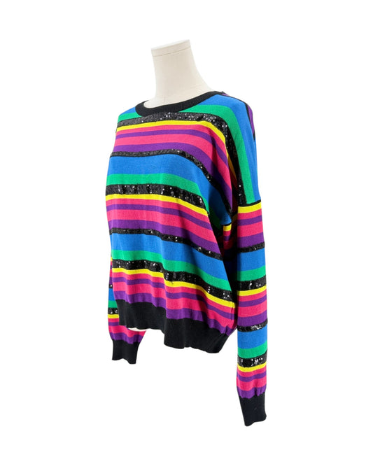 A multicolor striped knit sweater with black sequin accents, displayed on a mannequin torso against a white background.